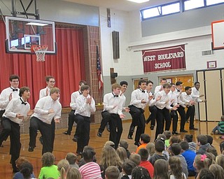 Neighbors | Zack Shively.The Spartan Singers performed a Tahitian folk song full of clapping and stomping. They ran into the audience and danced by the students and gave them high fives and handshakes during their song.