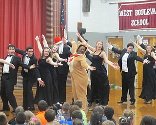 Neighbors | Zack Shively.The chorale mixed certain members of the Boardman Singers and the Spartan Singers for a song and dance full of characters and humorous banter. Students dressed up as Rudolph the Red-Nosed Reindeer, Frosty the Snowman, Suzy Snowflake and Santa Claus for the chorale.