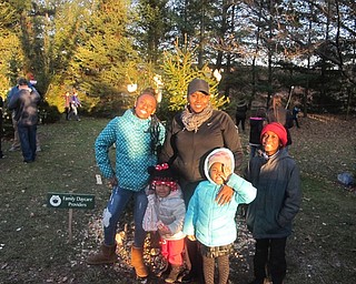 Neighbors | Zack Shively.Families, community groups and businesses decorated trees at Boardman Park's 21st annual Community Christmas. They decorated the trees with food for the animals heading into winter.