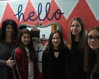 Neighbors | Abby Slanker.Canfield Village Middle School Language Arts teacher Michelle Napolitano joined CVMS students, from left, Karsyn Durham, Delaney O’Brien, Emme Rubin and Hailey Tomory in viewing a newly-remodeled girls restroom filled with inspirational quotes intended to empower and uplift the students on Nov. 30.