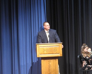 Neighbors | Zack Shively.The first piece the fifth grade played described their first couple months of learning how to play their instruments. Pictured, principal David Purins narrated the piece.