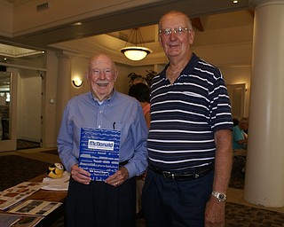 William Farragher recently spoke about his years in the steel industry at a meeting of the Austintown Friends of the Library. He is credited with designing the Youngstown Sheet and Tube logo. Above from left, are Farragher and John Pavlov. The next meeting of the group is set for 10 a.m. Monday at the library.
