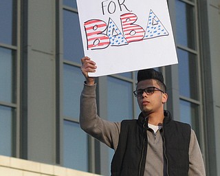 Abood Omoran of Youngstown holds a sign during a rally for Al Adi's release, Saturday, Jan. 20, 2018, at the Nathaniel R. Jones Federal Building & U.S. Courthouse in Youngstown...(Nikos Frazier | The Vindicator)