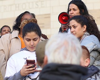 Fidaa Musleh(top) speaks during a rally for her husband, Al Adi's release, Saturday, Jan. 20, 2018, at the Nathaniel R. Jones Federal Building & U.S. Courthouse in Youngstown...(Nikos Frazier | The Vindicator)