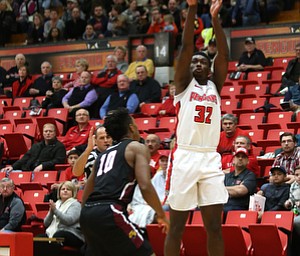 Youngstown State guard Garrett Covington (32) goes up for three over IUPUI guard NickÊRogers (10) in the first half of an NCAA college basketball game, Saturday, Jan. 20, 2018, in Youngstown. YSU won 85-62...(Nikos Frazier | The Vindicator)