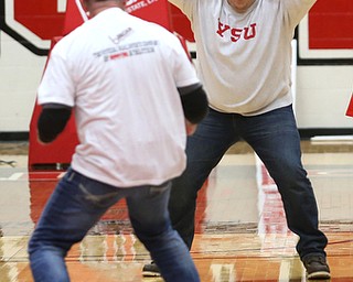 Bill Cupler goes up for a half court shot to win $12,000 from Burgan Real Estate during a media timeout at an NCAA college basketball game between YSU and IUPUI, Saturday, Jan. 20, 2018, in Youngstown...(Nikos Frazier | The Vindicator)