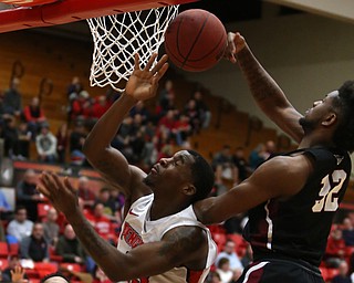 IUPUI forward ElyjahÊGoss (32) block's Youngstown State forward Naz Bohannon (33)'s shot in the first half of an NCAA college basketball game, Saturday, Jan. 20, 2018, in Youngstown. YSU won 85-62...(Nikos Frazier | The Vindicator)
