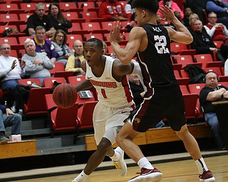 Youngstown State guard Braun Hartfield (1) drives past IUPUI guard D.J.ÊMcCall (22) in the second half of an NCAA college basketball game, Saturday, Jan. 20, 2018, in Youngstown. YSU won 85-62...(Nikos Frazier | The Vindicator)