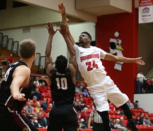 Youngstown State guard Cameron Morse (24) puts up two over IUPUI guard NickÊRogers (10) in the second half of an NCAA college basketball game, Saturday, Jan. 20, 2018, in Youngstown. YSU won 85-62...(Nikos Frazier | The Vindicator)