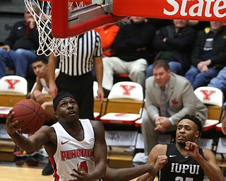 Youngstown State forward Tyree Robinson (0) goes up for a layup as IUPUI guard RonÊPatterson (25) reacts in the second half of an NCAA college basketball game, Saturday, Jan. 20, 2018, in Youngstown. YSU won 85-62...(Nikos Frazier | The Vindicator)
