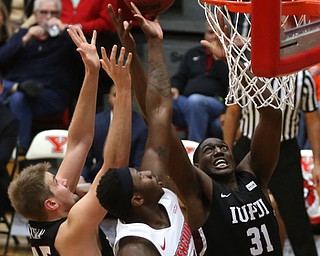IUPUI forward AaronÊBrennan (45) Youngstown State forward Tyree Robinson (0) and IUPUI forward MauriceÊKirby (31) go up for the rebound in the second half of an NCAA college basketball game, Saturday, Jan. 20, 2018, in Youngstown. YSU won 85-62...(Nikos Frazier | The Vindicator)
