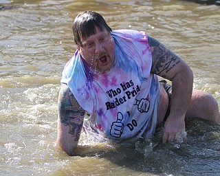 Warren Police Officer Mike Currington, a school resource officer at Warren Harding, participates in the annual Polar Bear Plunge in mid 30 degree water for the Special Olympics, Saturday, Jan. 20, 2018, at the Mosquito Lake State Park Swimming Beach in Cortland...(Nikos Frazier | The Vindicator)