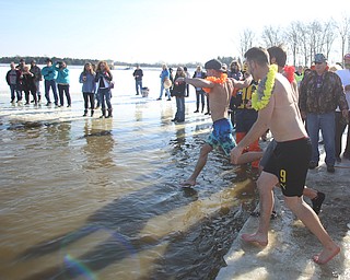 Participants in the annual Polar Bear Plunge in mid 30 degree water for the Special Olympics, Saturday, Jan. 20, 2018, at the Mosquito Lake State Park Swimming Beach in Cortland...(Nikos Frazier | The Vindicator)