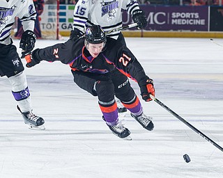 Scott R. Galvin | The Vindicator.Youngstown Phantoms center Mike Regush (21) reaches for the puck during the second period against the Tri-City Storm at the Covelli Centre on Saturday, January 20, 2018. The Phantoms lost 2-1 in overtime.