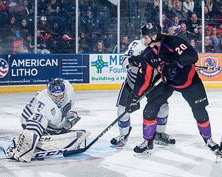Scott R. Galvin | The Vindicator.Youngstown Phantoms center Curtis Hall (20) makes shot against Tri-City Storm goalie Jake Barczewski (31) during the third period at the Covelli Centre on Saturday, January 20, 2018.  The Phantoms lost 2-1 in overtime.