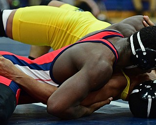 AUSTINTOWN, OHIO - JANUARY 20, 2018: Fitch's Breylon Douglas attempts to work the shoulders of Copley's Adam Allen to the mat during their 195lb championship bout, Saturday night at Austintown Fitch High school. DAVID DERMER | THE VINDICATOR