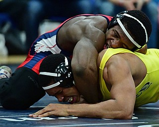AUSTINTOWN, OHIO - JANUARY 20, 2018: Fitch's Breylon Douglas controls the back of Copley's Adam Allen during their 195lb championship bout, Saturday night at Austintown Fitch High school. DAVID DERMER | THE VINDICATOR