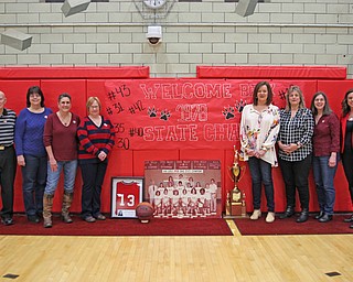 L-R) Coach Dick Prest, Cathy Miller Glasgow, Colleen Karnes, Lisa Laughner Shook, Becky Hanna Cene, Diane Shirilla Aron, Cheryl Simko Dubos, and Jackie Beachy represent the 1978 State Championship team from Struthers that was honored during Saturday afternoons matchup against Niles at Struthers High School.   Dustin Livesay  |  The Vindicator  1/20/18  Struthers