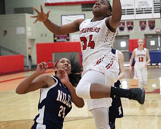 Keasia Chism (34) goes up for a layup over Madison Johnson (24) of Niles during Saturday afternoons matchup at Struthers High School.   Dustin Livesay  |  The Vindicator  1/20/18  Struthers