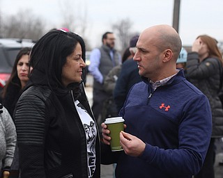 State Sen. Joe Schiavoni (D-Ohio) speaks with Fidaa Musleh, Al Adi's wife, before close to 200 community members attend a protest rally demanding the release of Al Adi, Sunday, Jan. 21, 2018, outside the Northeast Ohio Correctional Facility in Youngstown...(Nikos Frazier | The Vindicator)