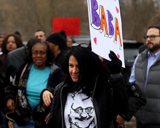 Fidaa Musleh, wife of Al Adi, holds a sign as close to 200 community members attend a protest rally demanding the release of Al Adi, Sunday, Jan. 21, 2018, outside the Northeast Ohio Correctional Facility in Youngstown...(Nikos Frazier | The Vindicator)