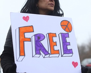 Fidaa Musleh, wife of Al Adi, holds a sign as close to 200 community members attend a protest rally demanding the release of Al Adi, Sunday, Jan. 21, 2018, outside the Northeast Ohio Correctional Facility in Youngstown...(Nikos Frazier | The Vindicator)
