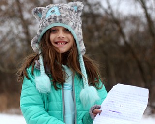 Amira Omran(7) holds a letter she wrote to Al Adi at a protest rally demanding the release of Adi, Sunday, Jan. 21, 2018, outside the Northeast Ohio Correctional Facility in Youngstown...(Nikos Frazier | The Vindicator)