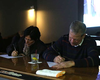 Jeff Hill of Youngstown(right) and Sue Horbath of Struthers write letters to Al Adi, Monday, Jan. 22, 2018, at Downtown Circle in Youngstown...(Nikos Frazier | The Vindicator)