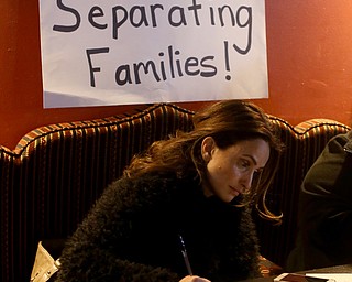 Gina Musleh of Boardman writes a letter to Al Adi, Monday, Jan. 22, 2018, at Downtown Circle in Youngstown...(Nikos Frazier | The Vindicator)