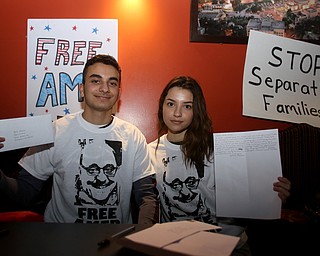 Mazin(17) and Yasmin(15) Musleh hold letters they wrote to their uncle Al Adi, Monday, Jan. 22, 2018, at Downtown Circle in Youngstown...(Nikos Frazier | The Vindicator)