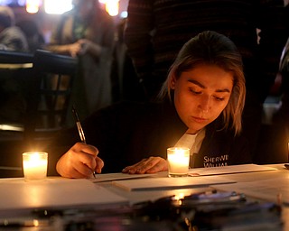 Jessica Kirr of Youngstown addresses envelopes for community members to send letters to Al Adi, Monday, Jan. 22, 2018, at Downtown Circle in Youngstown...(Nikos Frazier | The Vindicator)