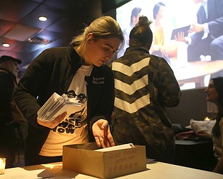 Jessica Kirr of Youngstown sifts through the box of letters community members wrote to Al Adi and Rebecca Adducci, Director of the Detroit ICE Field Office, Monday, Jan. 22, 2018, at Downtown Circle in Youngstown...(Nikos Frazier | The Vindicator)