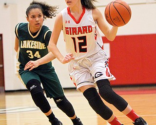 William D. Lewis The Vindicator   Girard's Emily Fitzgerald(12) drives  around Lakeside's LaTiana Flemming(34)  during 1-22-18 action at Girard.