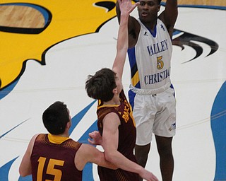 Valley Christians Milan Square (5) puts up a 3-pointer while being double teamed by Mike Cunningham (15) and Brennan Toy (4) of South Range during the first half of Friday nights matchup at Valley Christian in Youngstown  Dustin Livesay  |  The Vindicator  1/23/18  Valley Christian