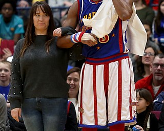 Globetrotter Moose escorts Amber Bonilla onto the court, Jan. 24, 2018, at the Covelli Centre in Youngstown...(Nikos Frazier | The Vindicator)