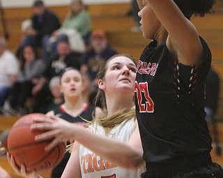 William D. Lewis The Vindicator  Newton Falls Bree Hutson(5) keeps the ball from Struthers Trinity McDowell(23) during 1-24-18 action at Falls.