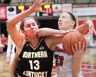 William D. Lewis The vindicator  YSU's Sarah Cash (23) gets wrapped up with NKU's Jazmyne Geist(13) during 1-25-18 action at YSY.