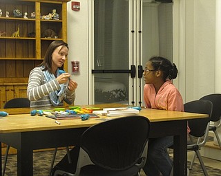 Neighbors | Zack Shively.The Austintown library had a program on Jan. 16 for teenagers to learn how to use a 3D pen. Librarian Alison Graf organized the event.
