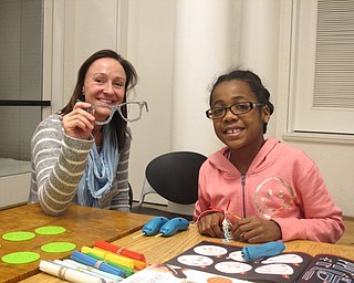 Neighbors | Zack Shively.The Austintown library's 3D pen set includes rechargable pens, material, activity books and molds. The books and molds help to make things, such as Alison Graf's glasses and Kennedy's helicopter.