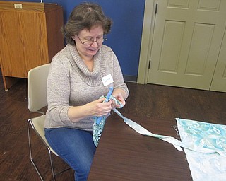 Neighbors | Zack Shively..The Boardman library's All About Yarn class began a "rag rug" project in November and finished it in December. The project asked the participants to make a rug out of old clothing. Pictured is Cynthia Wagner as she began crocheting together her rug.