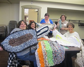 Neighbors | Zack Shively.The group at the All About Yarn program at the Boardman library on Dec. 8 finished their "rag rug" projects and learned how to add a non-slip material to the bottom. Pictured are, clockwise from front left, Dorothy Sabol, Gretchen Vargas, Karen Saunders, Cynthia Wagner and Eva Pavlov.