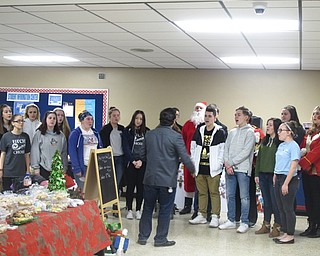 Neighbors | Zack Shively.Austintown Fitch's concert choir ran a craft show in the Fitch cafeteria to raise funds for their trip to New York and New Jersey in April. The choir performed "God Bless the U.S.A." at the craft show..