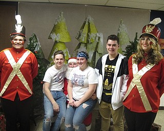 Neighbors | Zack Shively.Families could take pictures with the Fitch choir courtesy of Theresa Miller Photography at the group's craft show. Miller, a former choir students, was at the event selling discounted deals at the event. She donated $10 to the choir for each discounted booking she received.