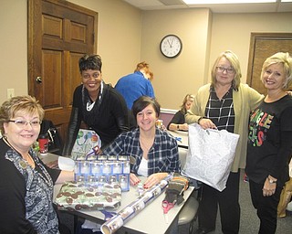 Neighbors | Zack Shively.Many organizations helped volunteer at Home Instead for their "Be a Santa to a Senior" program. Pictured, Brookdale Senior Living's staff helped wrap gifts. They are, from left, Administrative Assistant Lisa Gonzalez, Clare Bridge Program Coordinator Vanessa Montgomery, Executive Director Heidi Polonus, Nickie Keagy of Sales and Marketing and Assistant Client Care Coordinator Paulette Gettman of Home Instead.