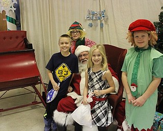 Neighbors | Abby Slanker.Mitchell and Caroline Bitner visited with the big man himself, Santa, at the Boy Scout Camp Stambaugh of the Great Trail Council Boy Scouts of America Breakfast with Santa on Dec. 16. Elves Mavrick Sutton (left) and Deklin Sutton (right) were Santa’s helpers for the day.