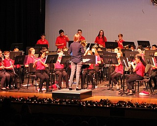Neighbors | Abby Slanker.Jessica Haley, student teacher from the University of Akron, conducted the Canfield Village Middle School seventh-grade band in performing “Feliz Navidad” at the school’s annual holiday concert on Dec. 12.