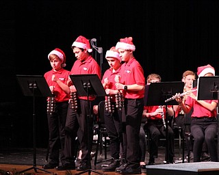Neighbors | Abby Slanker.Four members of the Canfield Village Middle School seventh-grade band played the sleigh bells at the school’s annual holiday concert.