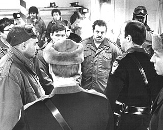 1978 Blizzard    OSHP Lt. Ricdhard Curtis, 2nd from right was in charge of gropund operations at the Jackson Twp. fire hall. .Other troopes are Paul Andrews(back to camera and Ken Marshall. National guardsman are Sgt Louis Wolf in helmet and goggles, Capt. Ralph Green and CaptConrad Bollo