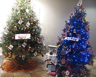 Neighbors | Zack Shively.Visitors enjoyed walking the holiday tree walk in the Davis Center throughout December. Community organizations decorated trees to be placed along the walk. Pictured are trees from the YMCA and Mahoning Valley Therapy Pets.