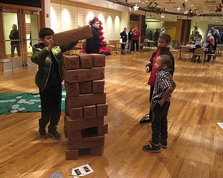 Neighbors | Zack Shively.Mill Creek Metroparks set up a number of games in the basement of the Davis Center for the Saturday night winter celebrations. The games included a spelling game, bingo and giant Jenga.